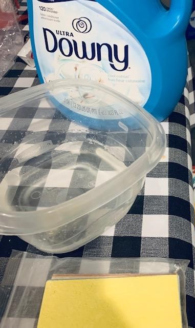 Pick out a container with a snap on lid, get some fabric softener, and buy some new sponges.