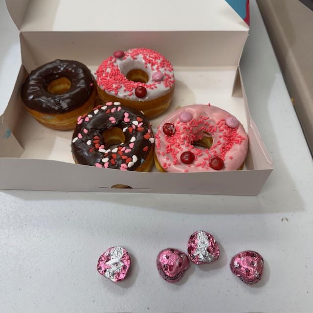 Valentine donuts & Dove chocolates! What a nice surprise.
