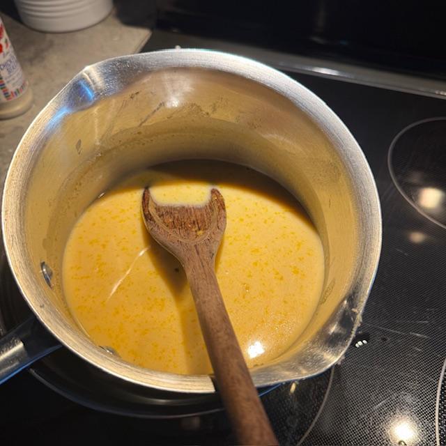 Putting the butterscotch filling together using butter, brown sugar, cornstarch, flour, milk, and vanilla.