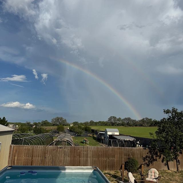 The main rainbow lasted a long time and got brighter before it disappeared. We did not get one drop of rain.