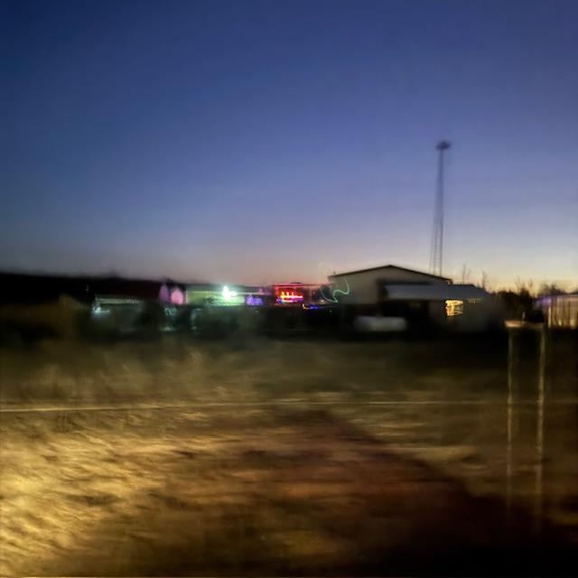 You can see our house from the neighbor's driveway. We have already backed up halfway down the long driveway at this point. There are no street lights.