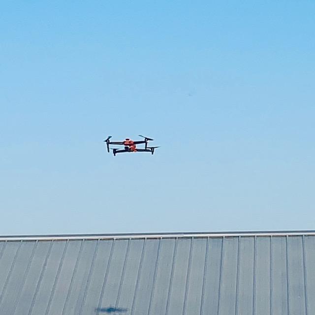 The drone is now higher and we are smaller.