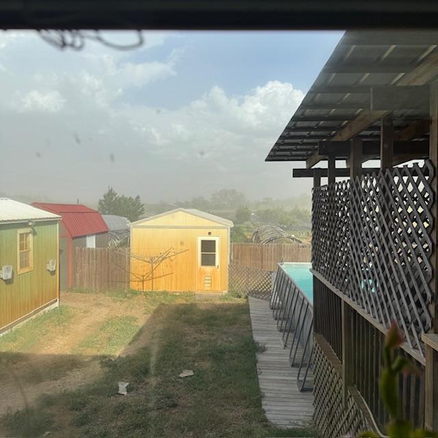 Our 3 sheds in the back and a big dust storm.