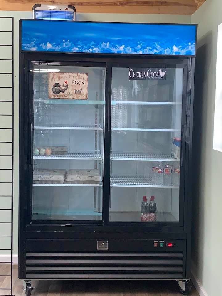 Our store fridge holds dozens of farm fresh eggs, waters, soft drinks of all kinds. Time to go buy more drinks. Our store fridge holds dozens of farm fresh eggs, waters, soft drinks of all kinds. Time to go buy more drinks.
