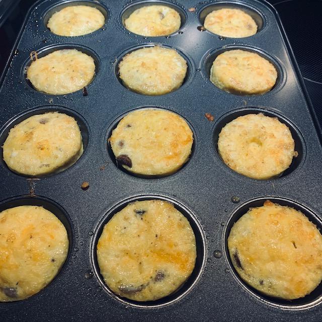 I put mushrooms, bits of potato from last night's roast, and cheddar cheese into the egg muffins.