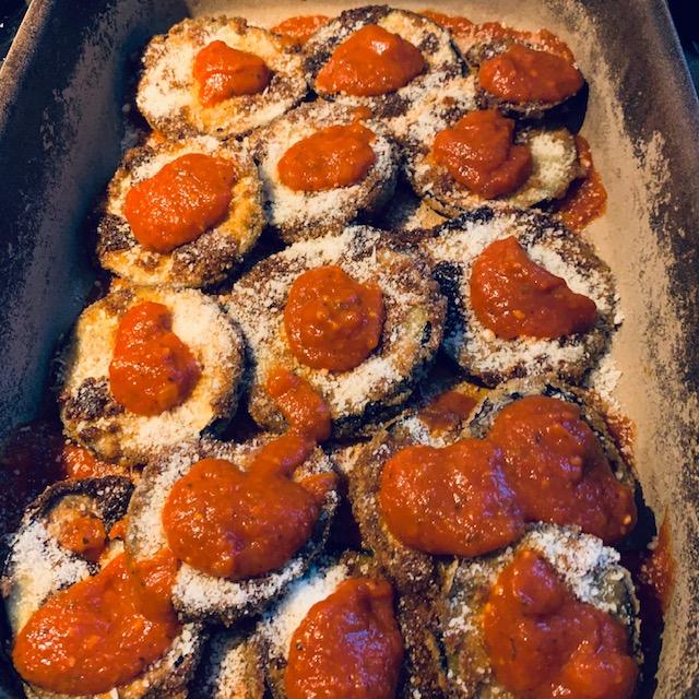 Begin the layering with sauce on the bottom of the pan and add the slices.