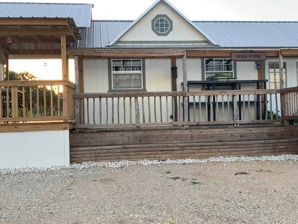 The flowerbeds in front of our farm store are now empty, awaiting new flower seeds.