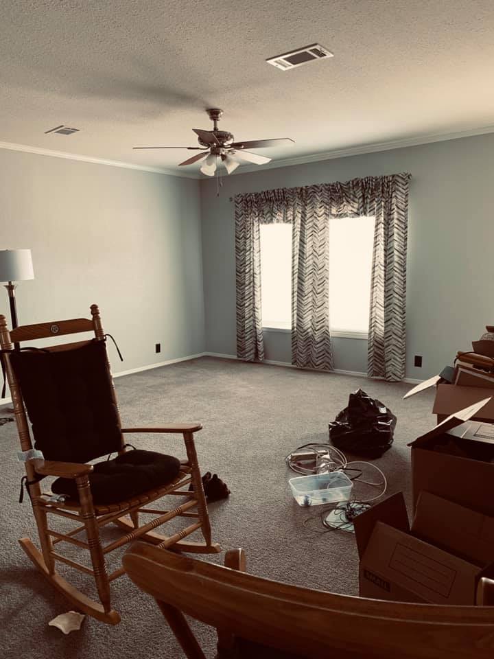 The new furniture will go in the far corner. The boxes have decorative items that we will use in the double wide manufactured home.