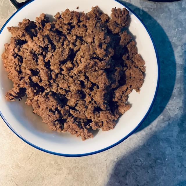 Brown some hamburger and then drain it well. You can also use ground chicken, ground turkey, or ground pork. They are all tasty in homemade enchiladas.