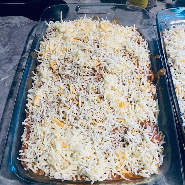 The homemade enchiladas are ready to bake.