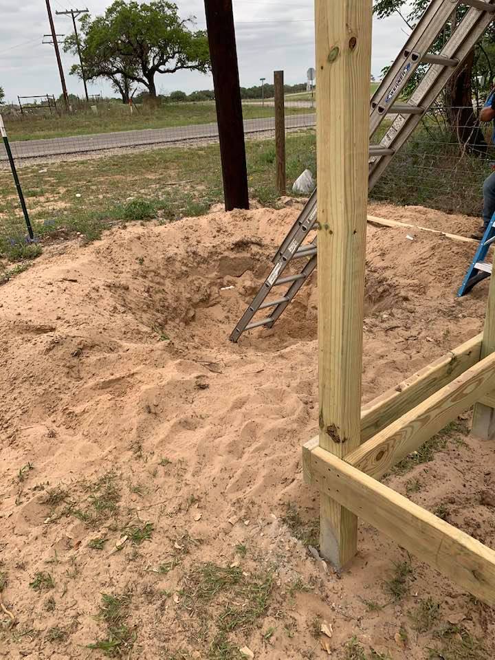 Digging the hole for the fish pond and falls outside of the gazebo.