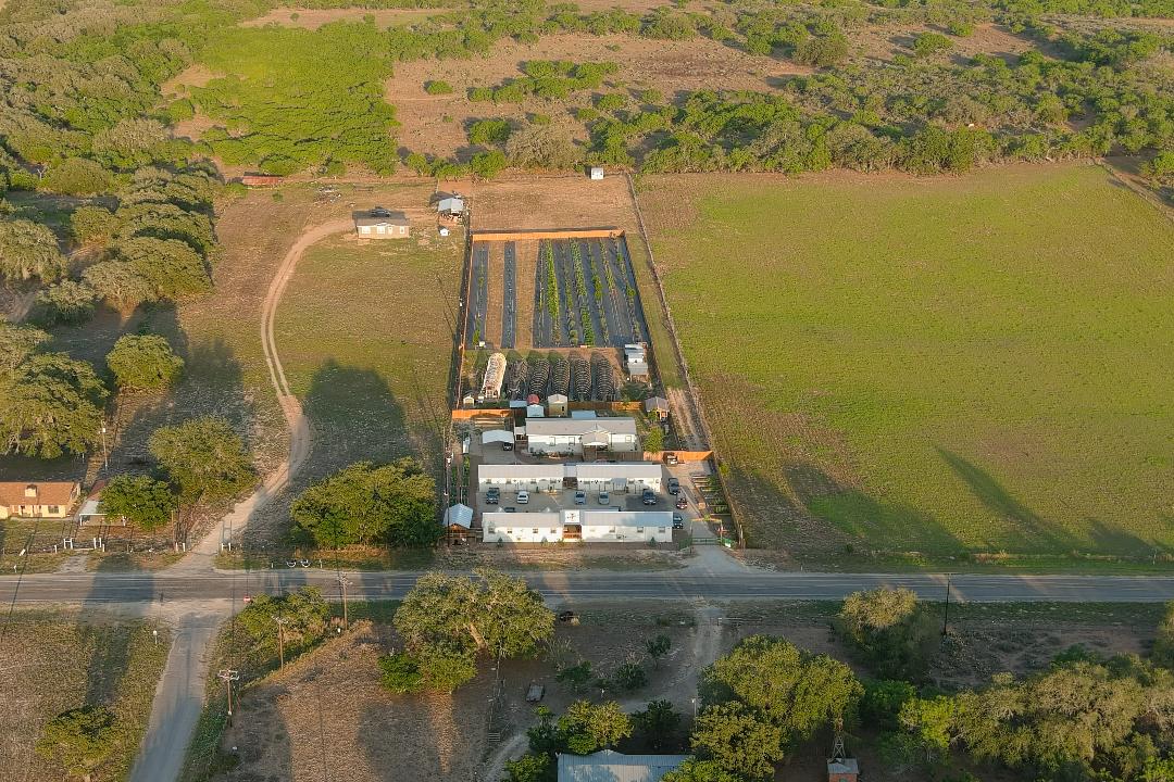 Our homestead for beginners is the crowded one in the middle. This photo shows parts of seven homesteads but ours is the only one with a business and working farm on it.