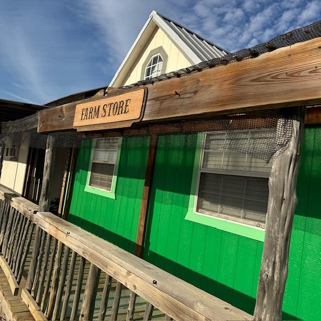 The Farm Store is painted green and has a sign that says "Farm Store" to make it a little easier to find the store among the buildings of this seed company.