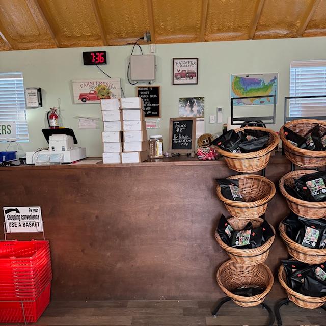 Here is the counter. We are still selling seeds here in the Farm Store. Also, you can make an order for pick up and we will have it ready for you to pick up.