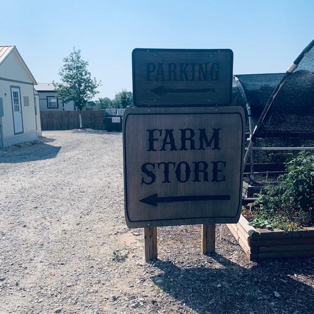Parking and store signs to direct you to our Farm Store as you drive in through our gate.
