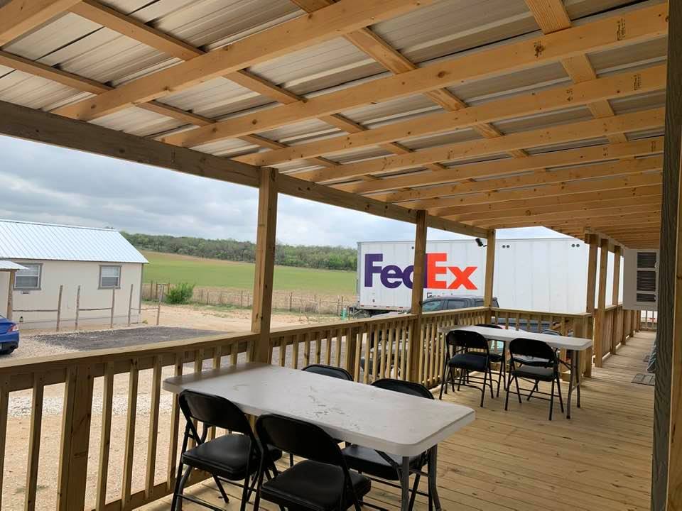 A FedEx truck brought us a lot of boxes for shipping. We ship all over the country.