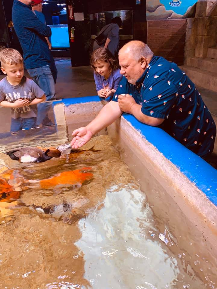 Grandpa David, Max, and Holley fed the fish and ducks.