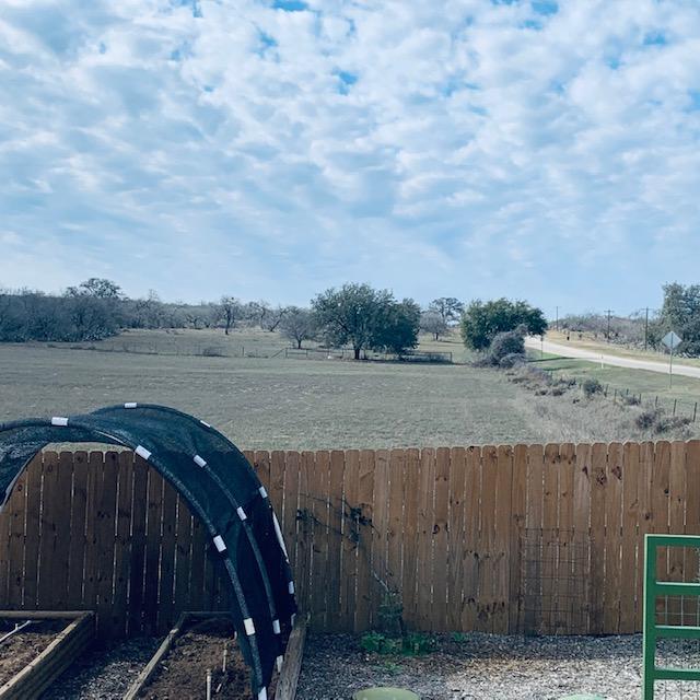 Now we own the next 168 feet along the road for four acres going up to the top fence line. FM 2504 is shown here and it is roughly 1/3 of the field.