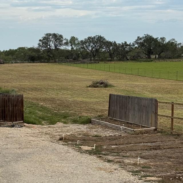 New property is finished being mowed with a burn pile in the middle.