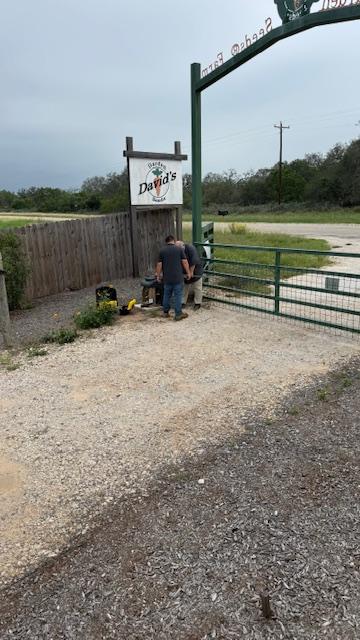 David and Matt are trying to put new batteries in the gate but they are the wrong kind.