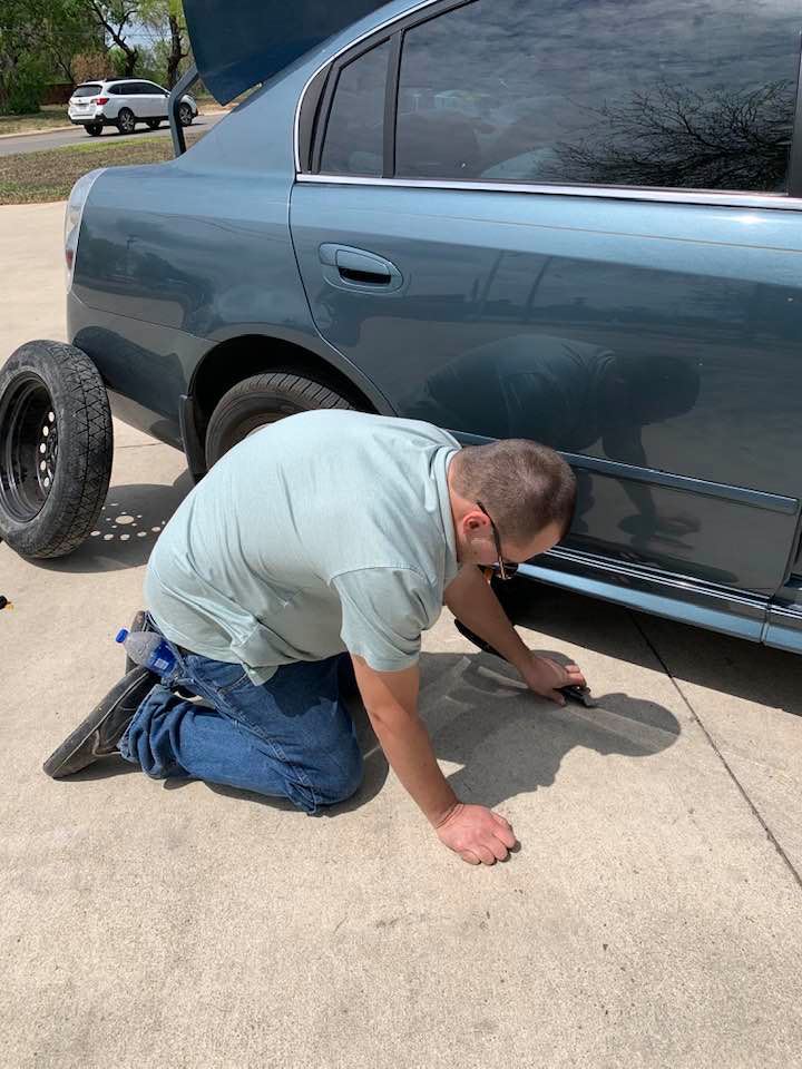 We pulled into an empty parking lot so Matthew could take off the wounded tire and put the spare on.