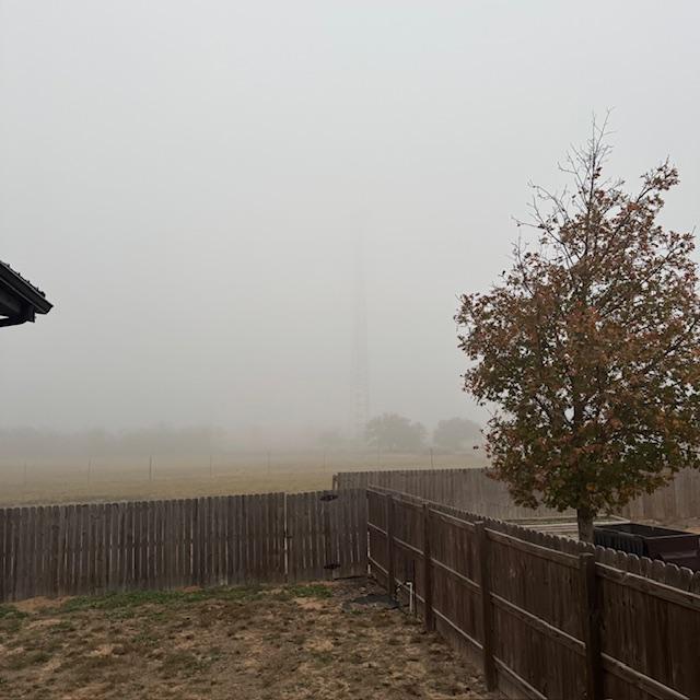 From my front porch looking toward the cell tower. The fog rolled in and seems to be getting thicker now.