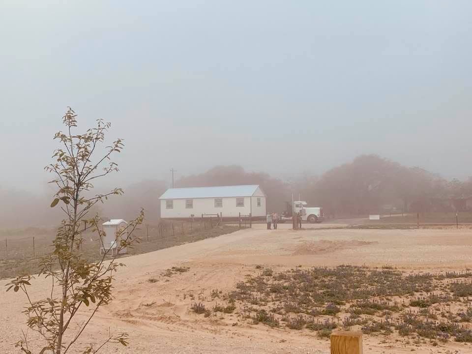 Tuesday was a foggy morning when the store building finally arrived in the farm yard.