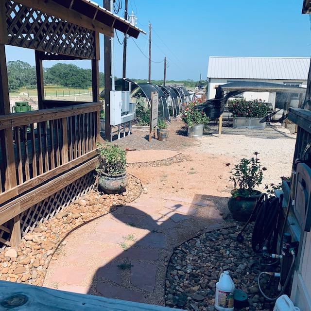 Gazebo and plant area in parking lot taken from bridge.