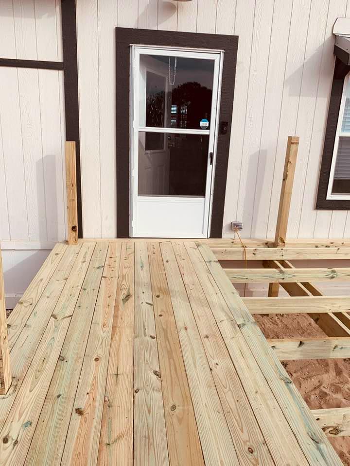 The beginning of the new front deck. It will be so nice not having to use the rickety steps from Palm Harbor Homes.