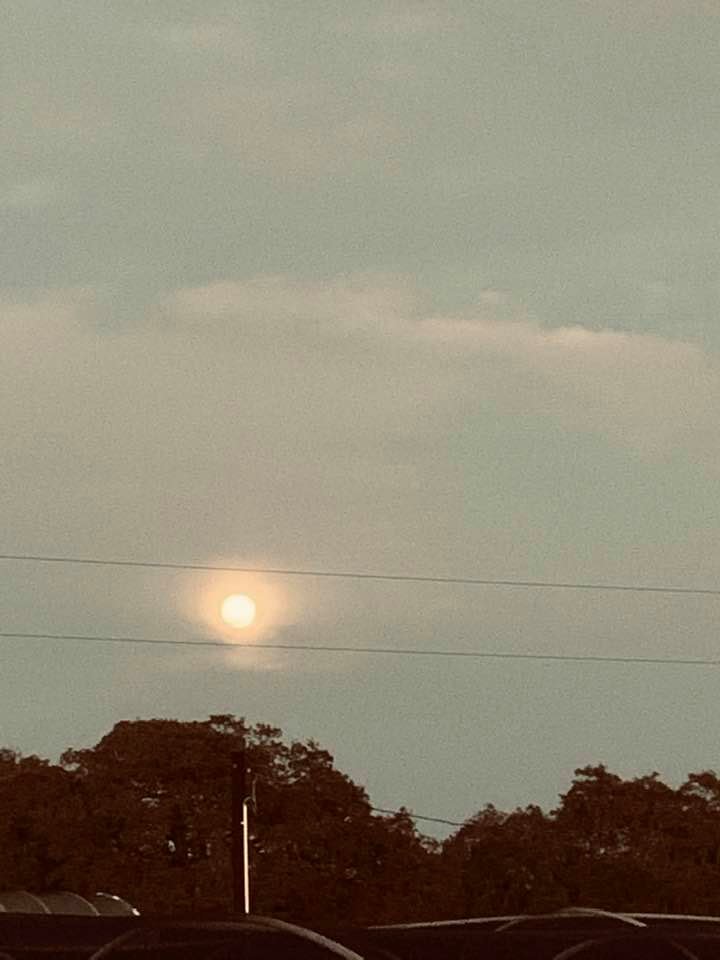 Tonight's full moon is between 2 electricity lines.