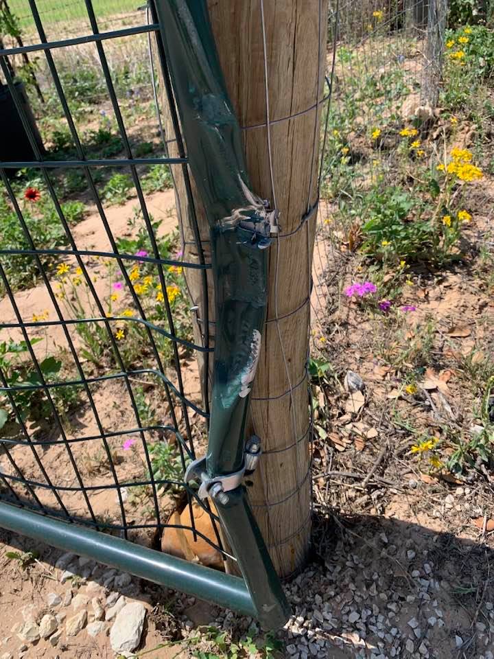 A closeup of our damaged gate caused by a FedEx delivery driver today.