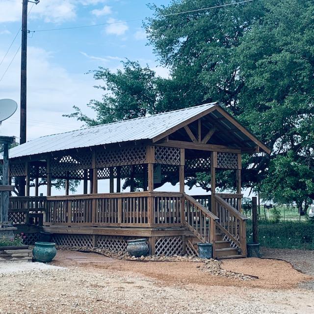 This is our gazebo which has part of the pond in it, with another pond outside of it. Both are connected by a short river.