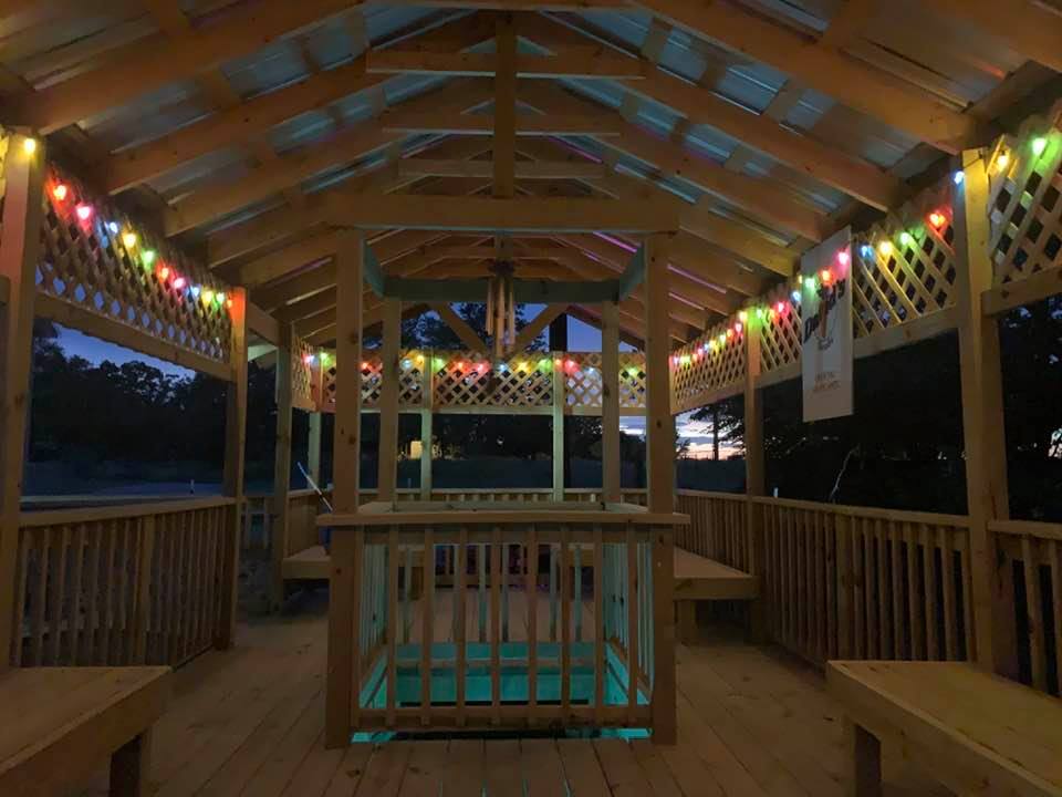This is our beautiful gazebo with the a square pond in the middle and plenty of seating. The sign on the right is our official selfie spot on the farm.