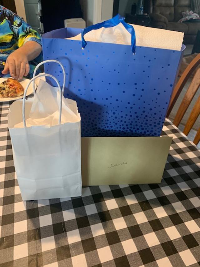 Presents with David's hand reaching for a slice. LOL!