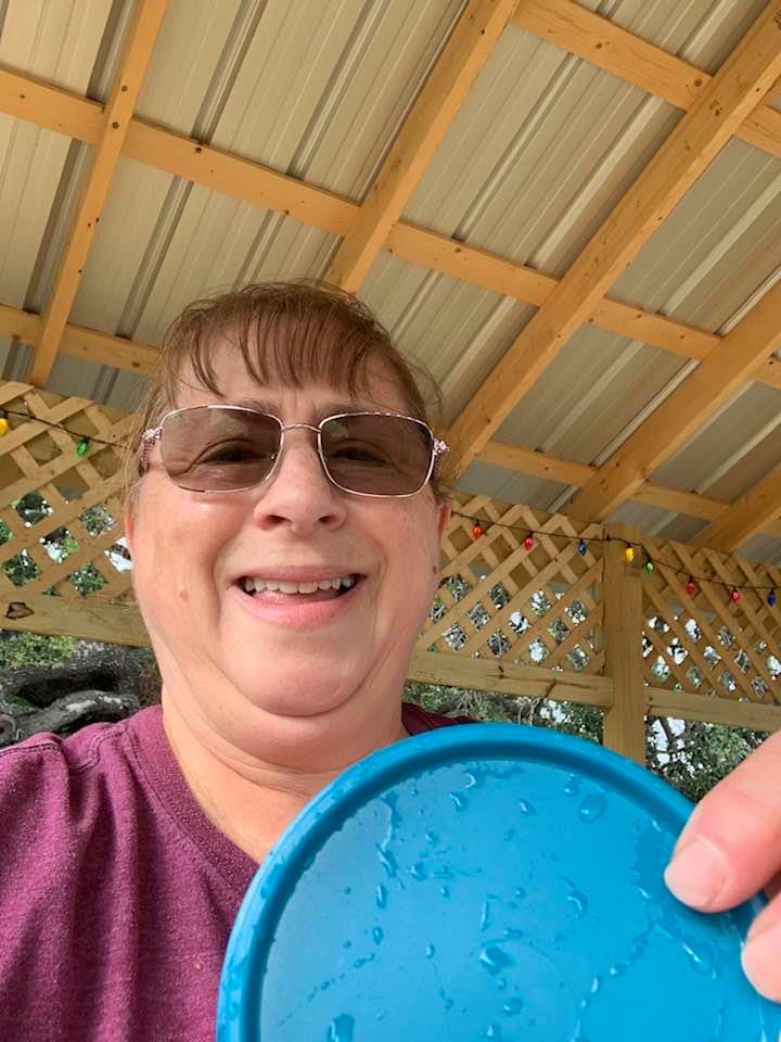 I finally was able to retrieve the lid to the fish food from the pond with a net and here it is.