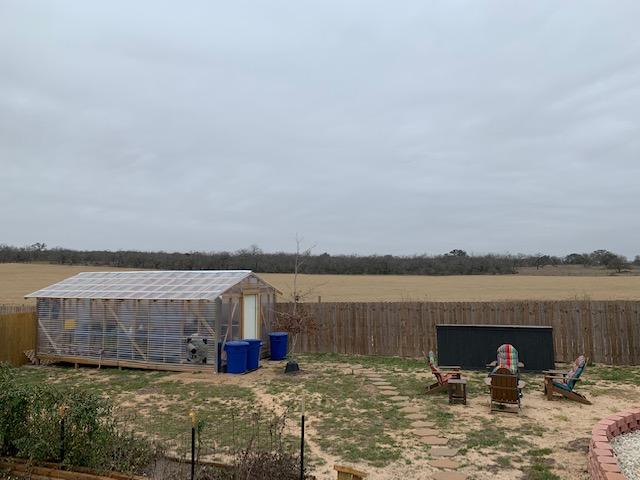 My greenhouse and fire pit area on this cloudy, cold morning.