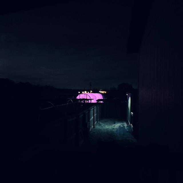 I took this shot off the side porch tonight to show you the glowing high tunnel out back.