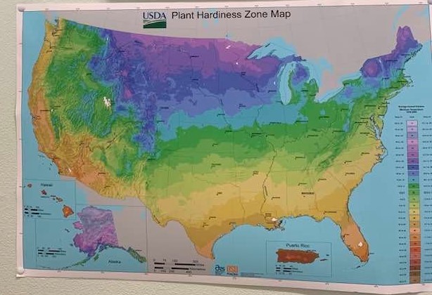 This growing zone map hangs on our store wall. We are located in growing zone 9A.