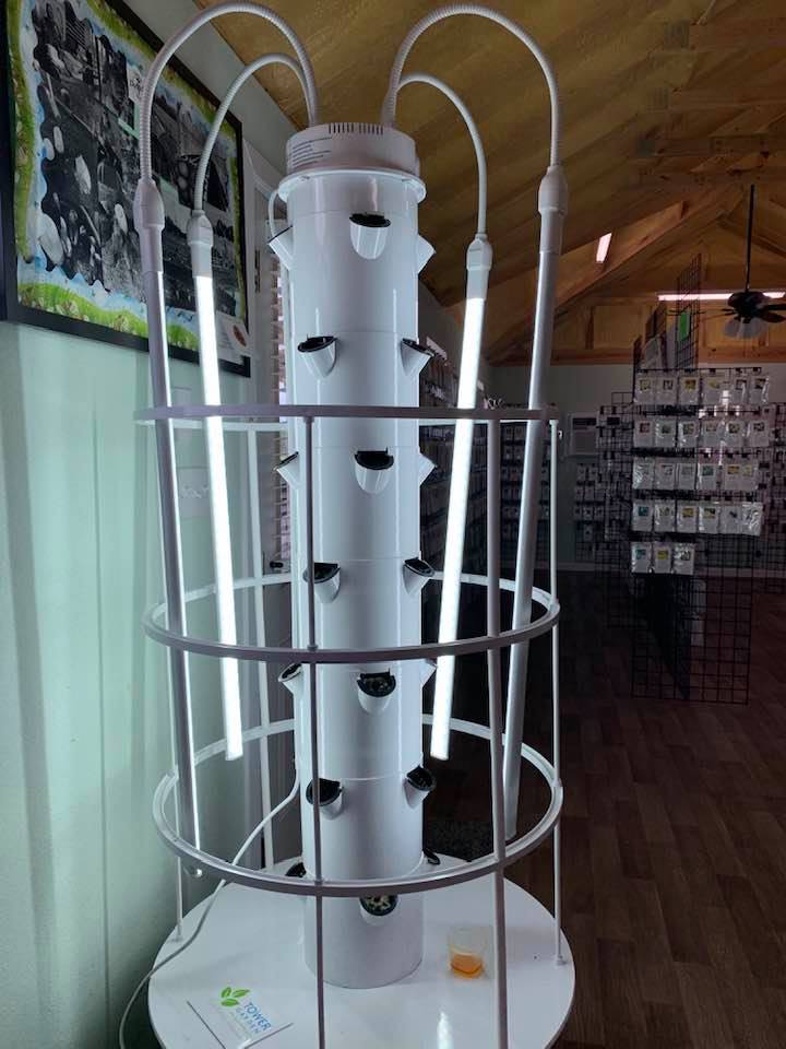 Grow lights on our hydroponic grow tower in the Farm Store. Grow lights on our hydroponic grow tower in the Farm Store.