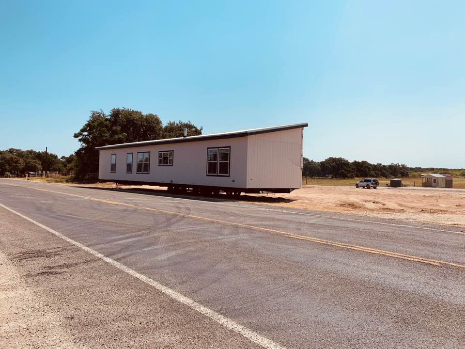 The back half of our new home dropped along the side of the road near our property.