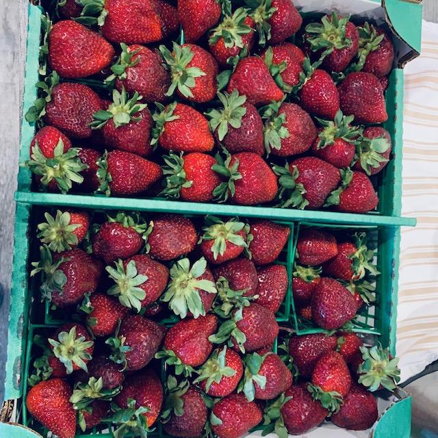 This is a half flat of strawberries. It really doesn't go far.