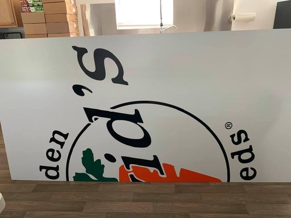 Here is the sign in 2 pieces that needs to be hung. Both halves lean against the island and you can see the commercial sink faucet above. Here is the sign in 2 pieces that needs to be hung. Both halves lean against the island and you can see the commercial sink faucet above.
