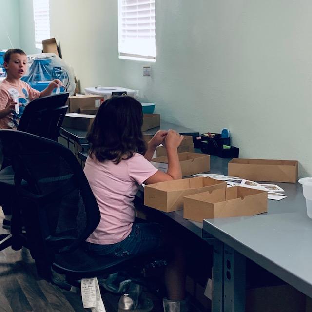 Holley and Max are having fun working at David's Garden Seeds®.