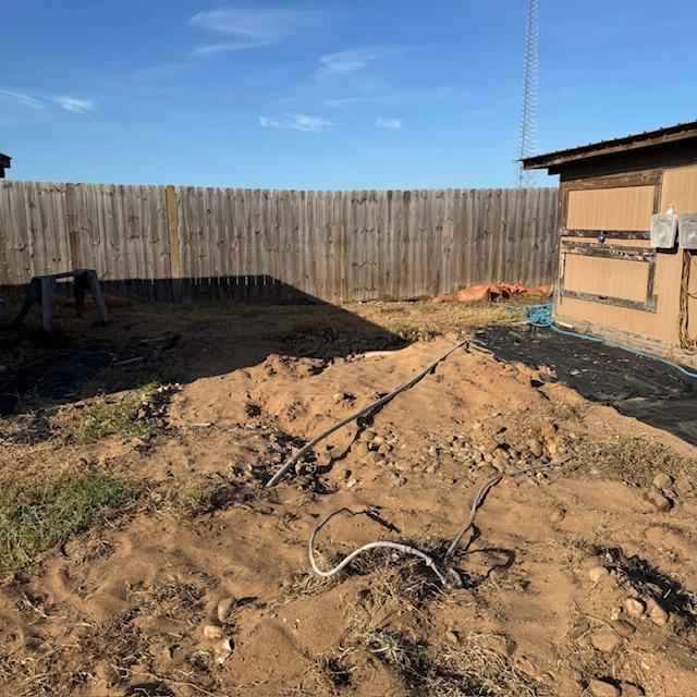 The white shed was hooked up to electric so those are electric cables in the photo that are now in the dirt. The white shed was hooked up to electric so those are electric cables in the photo that are now in the dirt.