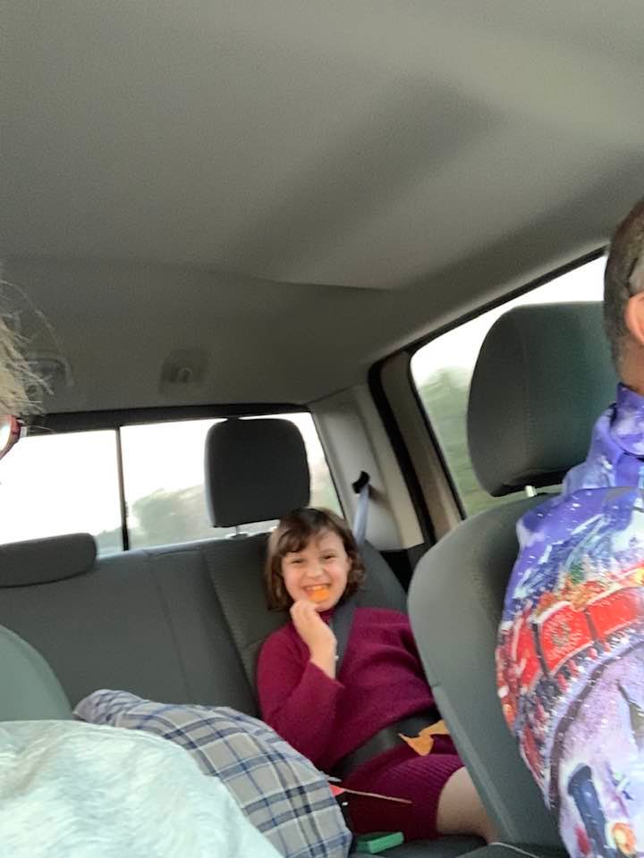 Holley is in the back of our truck having fun while Grandpa drives her around town shopping.