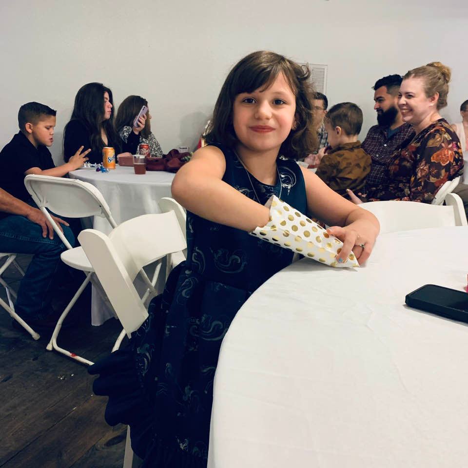 Holley at the reception eating candy.