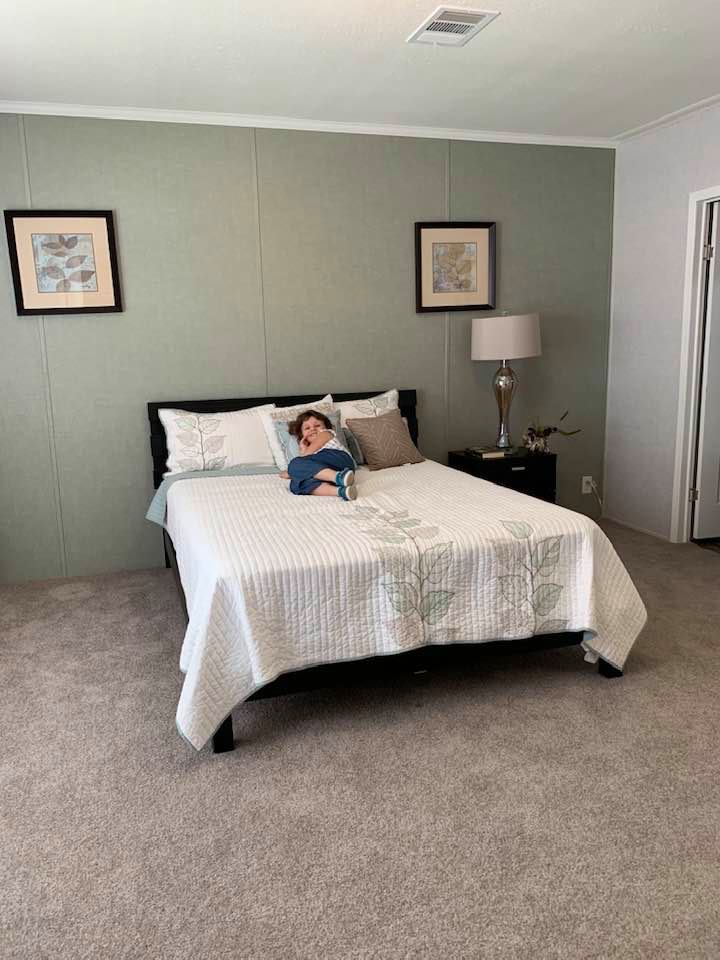 Holley, our granddaughter, claimed the master bedroom in the home that was too small as her own! Isn't she adorable?