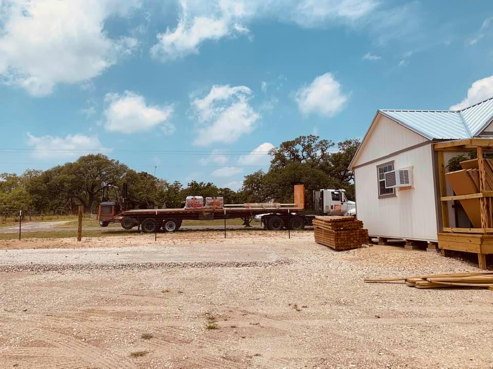 Supplies are being delivered. You can see the left side of our farm store in the photo.