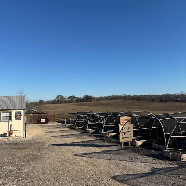 Some of the hoop houses along the driveway along with our dumpster and 4 acres of our new field. The rest of the field was recently purchased by someone else. Some of the hoop houses along the driveway along with our dumpster and 4 acres of our new field. The rest of the field was recently purchased by someone else.