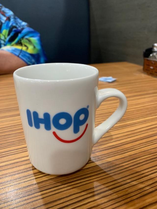 My coffee cup and David's arm at IHOP.